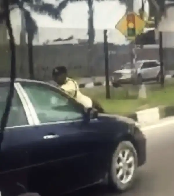 Lagos Woman Drives Off With LASTMA Official Hanging On Her Car Bonnet (Photo + Video)